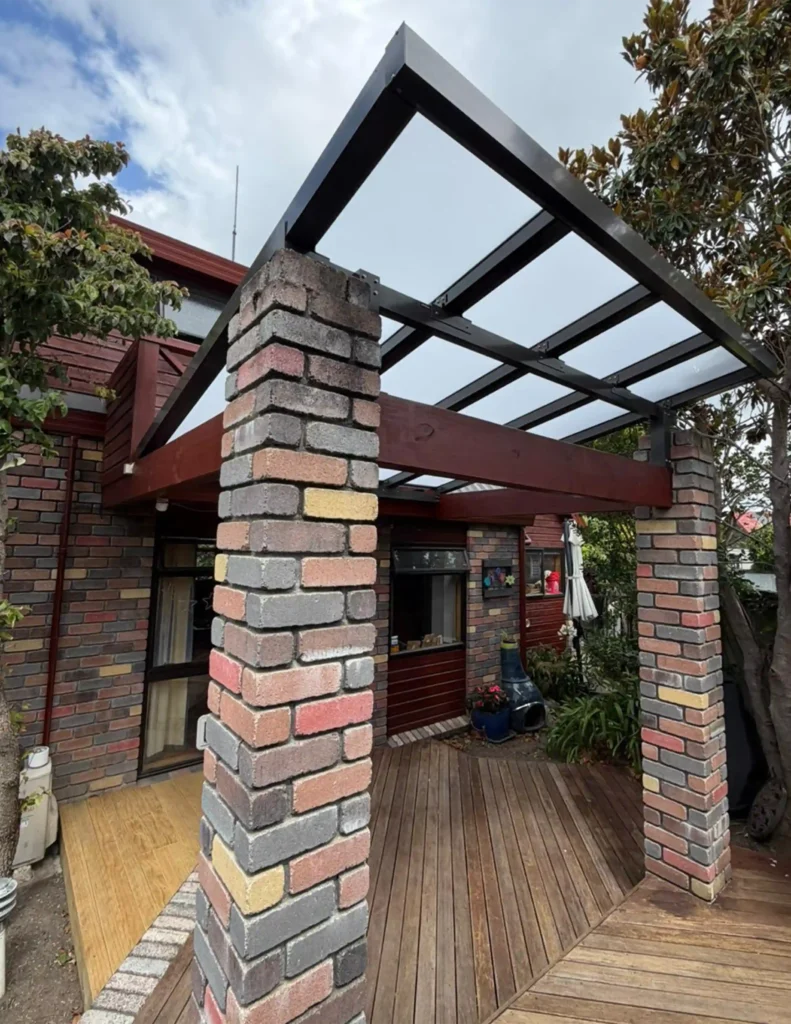 Custom Glazed Roof installed by Douglas Innovation on a Hawke's Bay home, providing a bright, weather-protected entrance and outdoor living area